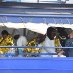 Foto Nicoloro G.   25/04/2023   Porto Corsini ( Ravenna )   E' attraccata al molo di Porto Corsini la MV Humanity 1 con a bordo 69 miigranti, di cui 39 provenienti dal Sudan, e i rimanenti da diversi paesi dell' Africa. Tra tutti si contano una sola donna e 20 minori non accompagnati. nella foto un gruppo di migranti in attesa di essere sbarcati.