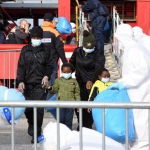 Foto Nicoloro G.   31/12/2022   Porto Corsini ( Ravenna )   La nave Ocean Viking con 113 migranti a bordo ha attraccato alla banchina del Terminal Crociere di Porto Corsini. nella foto sbarcano alcune donne con figli.