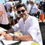 Foto Nicoloro G.   15/08/2022   Cervia (RA)   30° edizione di ' Cervia, la spiaggia ama il libro ' con il tradizionale arrivo degli scrittori dal mare su storiche imbarcazioni e sbarco sulla spiaggia di Cervia. nella foto il giornalista Stefano Tura.