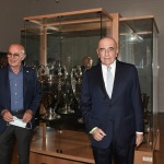 Foto Nicoloro G.   02/09/2021   Fusignano ( Ra )   Inaugurazione della mostra dedicata ad Arrigo Sacchi dal titolo  ' Oltre il sogno. L' emozione del calcio totale di Arrigo Sacchi '. nella foto Arrigo Sacchi e Adriano Galliani davanti alla vetrina con due coppe del Milan.