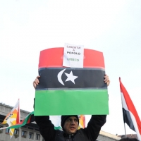 Foto Nicoloro G. 04/03/2011 Milano Manifestazione in piazza Loreto con corteo di un centinaio di immigrati libici contro il regime di Gheddafi a cui hanno partecipato anche immigrati tunisini ed egiziani. nella foto Manifestante con cartello