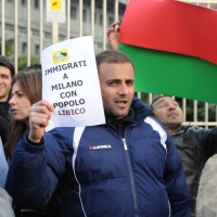 Foto Nicoloro G. 04/03/2011 Milano Manifestazione in piazza Loreto con corteo di un centinaio di immigrati libici contro il regime di Gheddafi a cui hanno partecipato anche immigrati tunisini ed egiziani. nella foto Manifestante con cartello