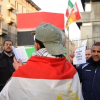Foto Nicoloro G. 04/03/2011 Milano Manifestazione in piazza Loreto con corteo di un centinaio di immigrati libici contro il regime di Gheddafi a cui hanno partecipato anche immigrati tunisini ed egiziani. nella foto Manifestanti con bandiere e cartelli