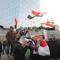 Foto Nicoloro G. 04/03/2011 Milano Manifestazione in piazza Loreto con corteo di un centinaio di immigrati libici contro il regime di Gheddafi a cui hanno partecipato anche immigrati tunisini ed egiziani. nella foto Manifestanti con altoparlante, bandiere e cartelli