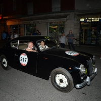 Foto Nicoloro G.  14/05/2015  Rimini     Arriva a Rimini la prima tappa della 33° edizione della 1000 Miglia. La storica competizione partita da Brescia si snoda su un percorso di 1760 chilometri con la partecipazione di 438 vetture e 42 Nazioni. nella foto l' arrivo a Rimini di Cesare Florio, ex pilota e d ex direttore sportivo Ferrari, su una Lancia Aurelia B20 GT 2000 del 1952.