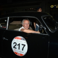 Foto Nicoloro G.  14/05/2015  Rimini     Arriva a Rimini la prima tappa della 33° edizione della 1000 Miglia. La storica competizione partita da Brescia si snoda su un percorso di 1760 chilometri con la partecipazione di 438 vetture e 42 Nazioni. nella foto l' arrivo a Rimini di Cesare Florio, ex pilota ed ex direttore sportivo Ferrari, su una Lancia Aurelia B20 GT 2000 del 1951.