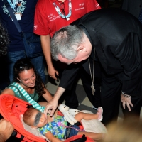 Foto Nicoloro G. 26/08/2017 Rimini Settima ed ultima giornata della 38° edizione del Meeting di Rimini che quest' anno ha come tema ' Quello che tu erediti dai tuoi padri, riguadagnatelo, per possederlo”. nella foto il cardinale Pietro Parolin, Segretario di Stato di Sua Santita', si ferma a salutare un bimbo.
