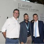 Foto Nicoloro G.   25/08/2022   Rimini   Sesta ed ultima giornata della 43° edizione del Meeting di C.L. che ha per tema '  Una passione per l' uomo '. nella foto da sinistra il ministro Giancarlo Giorgetti, il direttore del Meeting Emanuele Forlani e il segretario Lega Romagna Jacopo Morrone in visita allo stand che ricorda il giudice Rosario Livatino.
