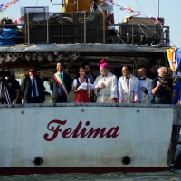 Foto Nicoloro G.   17/05/2015  Cervia ( Ravenna )   571° edizione dello \" Sposalizio del Mare \", antico rito che ha il suo momento caratterizzante nel lancio in mare dell\' anello da parte dell\' arcivescovo e l\' immediata sfida tra pescatori per recuperarlo dalle acque. nella foto da sinistracon la fascia il sindaco di Cervia Luca Coffari, la Dama dell\' Anello e l\' arcivescovo Lorenzo Ghizzoni.