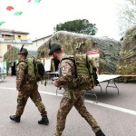 Foto Nicoloro G.   05/05/2022  Rimini   93° Adunata Nazionale Alpini che , come da consuetudine, hanno invaso la cittadina romagnola provenienti da ogni regione d' Italia. Il culmine della manifestazione  sara' domenica 8 Maggio con ' l' ammassamento ' sul lungomare di Rimini e la sfilata alla presenza delle massime autorita'. nella foto alcuni alpini in servizio attivo arrivano nella ' cittadella storica ' allestita con tendoni.