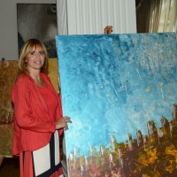 Foto Nicoloro G. 08/07/2016 Milano Marittima ( Ravenna ) L\' europarlamentare Alessandra Mussolini inaugura al Palace Hotel di Milano Marittima una mostra di suoi dipinti dal titolo \' Graffi \'. nella foto Alessandra Mussolini con alcuni dei suoi dipinti.