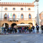 Foto Nicoloro G.   27/11/2021   Ravenna    Flash mob ' Uomini in scarpe rosse '. Un corteo di uomini con scarpe rosse ha sfilato nel centro di Ravenna per dire No alla violenza sulle donne. nella foto sosta davanti al palazzo del Comune.