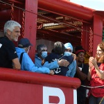 Foto Nicoloro G.   16/07/2025   Ravenna   E' attraccata  al porto di Ravenna la nave ong Ocean Viking con a bordo soltanto 16 migranti salvati davanti alle coste libiche. nella foto un ultimo abbraccio dopo tanti giorni di navigazione insieme.