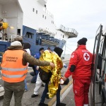 Foto Nicoloro G.   22/11/2023   Porto Corsini ( Ravenna )   La nave ong di Medici senza Frontiere \' Geo Barents \'  ha attraccato a Porto Corsini con a bordo 57 migranti salvati da un barcone di legno nella zona di Malta. I 57 migranti, 44 adulti e 13 minori tutti uomini, provenivano dal Bangladesh, da Sud Sudan, Egitto, Etiopia, Eritrea e Pakistan. nella foto i migranti vengono fatti salire su un mezzo della Croce Rossa per essere trsportati in una struttura per gli accertamenti e le visite mediche accurate.