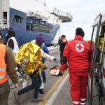 Foto Nicoloro G.   22/11/2023   Porto Corsini ( Ravenna )   La nave ong di Medici senza Frontiere ' Geo Barents '  ha attraccato a Porto Corsini con a bordo 57 migranti salvati da un barcone di legno nella zona di Malta. I 57 migranti, 44 adulti e 13 minori tutti uomini, provenivano dal Bangladesh, da Sud Sudan, Egitto, Etiopia, Eritrea e Pakistan. nella foto i migranti vengono fatti salire su un mezzo della Croce Rossa per essere trsportati in una struttura per gli accertamenti e le visite mediche accurate.