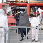Foto Nicoloro G.   31/12/2022   Porto Corsini ( Ravenna )   La nave Ocean Viking con 113 migranti a bordo ha attraccato alla banchina del Terminal Crociere di Porto Corsini. nella foto il primo a scendere e' un migrante in precarie condizioni di salute.