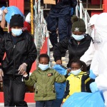 Foto Nicoloro G.   31/12/2022   Porto Corsini ( Ravenna )   La nave Ocean Viking con 113 migranti a bordo ha attraccato alla banchina del Terminal Crociere di Porto Corsini. nella foto lo sbarco di due bambini non accompagnati.