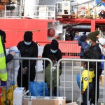Foto Nicoloro G.   31/12/2022   Porto Corsini ( Ravenna )   La nave Ocean Viking con 113 migranti a bordo ha attraccato alla banchina del Terminal Crociere di Porto Corsini. nella foto sbarcano alcune donne con figli.