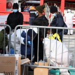 Foto Nicoloro G.   31/12/2022   Porto Corsini ( Ravenna )   La nave Ocean Viking con 113 migranti a bordo ha attraccato alla banchina del Terminal Crociere di Porto Corsini. nella foto sbarcano alcune donne con figli.