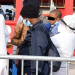 Foto Nicoloro G.   31/12/2022   Porto Corsini ( Ravenna )   La nave Ocean Viking con 113 migranti a bordo ha attraccato alla banchina del Terminal Crociere di Porto Corsini. nella foto lo sbarco di una donna con figlio.