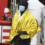 Foto Nicoloro G.   31/12/2022   Porto Corsini ( Ravenna )   La nave Ocean Viking con 113 migranti a bordo ha attraccato alla banchina del Terminal Crociere di Porto Corsini. nella foto lo sbarco di un migrante.