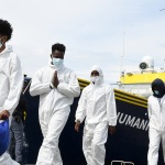 Foto Nicoloro G.   13/05/2025   Ravenna   E' approdata nel porto di Ravenna la nave ong tedesca Humanity 1 con a bordo 125 migranti. Tra tutti anche 4 donne e circa 50 minori non accompagnati. La maggior parte provenienti dall' Eritrea e dall' Etiopia, ma anche dal Sudan, dall' Efitto e dal Pakistan. Nei racconti dei migranti le testimonianze delle tante difficolta' per sfuggire alle guerre prima e alle torture dei libici dopo. Alcuni hanno raccontato di essere stati rapiti e venduti come schiavi. nella foto un momento dello sbarco.