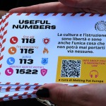 Foto Nicoloro G.   06/05/2025   Ravenna   Ha attraccato nel porto di Ravenna la nave ong Solidaire con a bordo 67 migranti tra i quali 9 minori non accompagnati. Tutti uomini provenienti dal Bangladesh tranne due provenienti dall\' Egitto e due dal Marocco. nella foto la cartolina con i numeri di telefono in caso di emergenza.