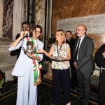 Foto Nicoloro G.   13/09/2026   Ravenna   Nell' ambito delle celebrazioni per il 705° annuale della morte di Dante Alighieri si e' svolta la tradizionale cerimonia dell' offerta da parte della citta' di Firenze dell' olio che alimentera' la lampada che illumina perennemente la tomba del Sommo Poeta. nella foto la vicesindaca di Firenze Paola Galgani accende la lampada che illumina sempre la tomba di Dante.