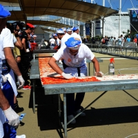 Foto Nicoloro G.  20/06/2015  Milano   Realizzata la pizza più lunga del mondo all' Expo 2015. nella foto la spalmatura della salsa di pomodoro.