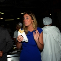 Foto Nicoloro G.  01//09/2014   Ravenna    Festa Provinciale de L' Unità. nella foto il ministro Maria Elena Boschi, dopo l' intervista, visita gli stand gastronomici della Festa con doveroso assaggio di piadina.
