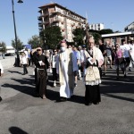 Foto Nicoloro G.   Cervia (RA)   13/06/2022   Festeggiamenti in onore di Sant' Antonio, protettore dei marinai e dei salinari, con corteo che raggiungera' il porto da dove la statua del Santo verra' imbarcata e portata in mare aperto per la tradizionale benedizione e lancio in mare di una corona . nella foto durante la processione l' arcivescovo Lorenzo Ghizzoni, a sinistra, e don Antonio Maffei.