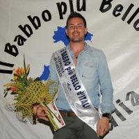 Foto Nicoloro G. 08/07/2011 Gatteo Mare (FC) Finale della diciannovesima edizione de " Il babbo piu' bello d' Italia " tra sedici concorrenti che si contendono la palma di babbo più bello sfidandosi in simpatia, prestanza e prove di canto, preparazione di pasta fatta a mano o cambio del pannolino ad un bambolotto. nella foto Antonio Torella, il vincitore