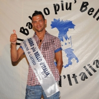 Foto Nicoloro G. 19/08/2010 Gatteo Mare (FC) Finale della sedicesima edizione di "Il babbo più bello d' Italia" tra sedici concorrenti che si contendono la palma di babbo più bello sfidandosi in simpatia, prestanza e prove di canto, preparazione di pasta fatta a mano o cambio del pannolino ad un bambolotto. nella foto Marco Citterio il vincitore