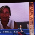Foto Nicoloro G.   21/08/2020   Rimini    Quarta giornata del Meeting di CL 2020, che in questa edizione ha per titolo ' Privi di meraviglia, restiamo sordi al sublime '. nella foto a sinistra il governatore della Sicilia Nello Musumeci e Gianluca Comin, presidente della Comin & Partners mentre seguono la diretta video di Sabina Nuti, rettrice della Scuola Superiore Sant' Anna di Pisa.
