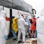 Foto Nicoloro G.   03/01/2024   Porto Corsini - Ravenna   Ha attraccato nel porto di Ravenna la nave di Medici senza Frontiere Geo Barents con a bordo 336 migranti. Di questi 229 sono uomini, 3 donne e 34 minori di cui 27 non accompagnati. Provenienti da diversi paesi, come Pakistan, Eritrea, Egitto, Yemen, Siria e anche Palestina, verrano ripartiti equamente, secondo un piano del Viminale, tra Lombardia, Toscana ed Emilia-Romagna. nella foto i migranti vengono fatti salire su un pulmino della Croce Rossa per essere trasferiti al palazzetto dello Sport dove verranno sottoposti alle prime pratiche di assistenza medica ed identificazione.