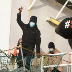 Foto Nicoloro G.   03/01/2024   Porto Corsini - Ravenna   Ha attraccato nel porto di Ravenna la nave di Medici senza Frontiere Geo Barents con a bordo 336 migranti. Di questi 229 sono uomini, 3 donne e 34 minori di cui 27 non accompagnati. Provenienti da diversi paesi, come Pakistan, Eritrea, Egitto, Yemen, Siria e anche Palestina, verrano ripartiti equamente, secondo un piano del Viminale, tra Lombardia, Toscana ed Emilia-Romagna. nella foto un gesto di gioia ed esultanza per avercela fatta.