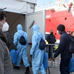 Foto Nicoloro G.   18/02/2023   Porto Corsini ( Ravenna )   La nave Ocean Viking dell\' Ong Sos Mediterranee e\' sbarcata con a bordo 84 naufraghi di cui 58 minori non accompagnati e 26 uomini adulti. nella foto alcuni migranti appena sbarcati vengono introdotti nel capannone di prima accoglienza.