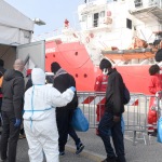 Foto Nicoloro G.   18/02/2023   Porto Corsini ( Ravenna )   La nave Ocean Viking dell\' Ong Sos Mediterranee e\' sbarcata con a bordo 84 naufraghi di cui 58 minori non accompagnati e 26 uomini adulti. nella foto alcuni migranti appena sbarcati vengono introdotti nel capannone di prima accoglienza.
