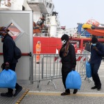 Foto Nicoloro G.   18/02/2023   Porto Corsini ( Ravenna )   La nave Ocean Viking dell' Ong Sos Mediterranee e' sbarcata con a bordo 84 naufraghi di cui 58 minori non accompagnati e 26 uomini adulti. nella foto alcuni migranti appena sbarcati vengono introdotti nel capannone di prima accoglienza.