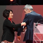 Foto Nicoloro G.   15/03/2023   Rimini   Prima giornata del XIX Congresso Nazionale CGIL dal titolo ' Il lavoro crea il futuro '.   nella foto viene messo il nastrino bianco in memoria di tutte le vittime degli sbarchi al braccio di Maurizio Landini.